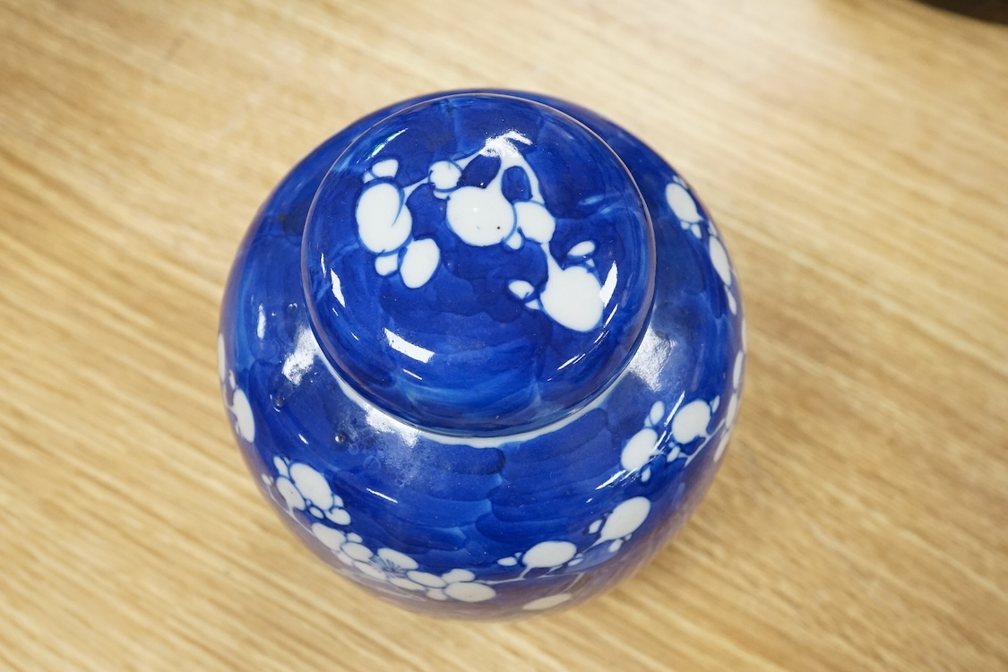 A 19th century Chinese blue and white prunus jar and cover, 15cm high